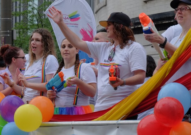 three women with super soakers (water guns) on a float in the pride parade, ONA, ontario nurses association 