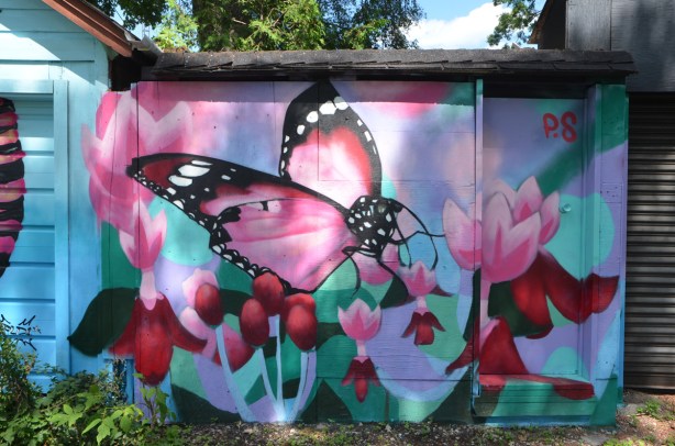 large pink butterfly with pink and red flowers by P.S.