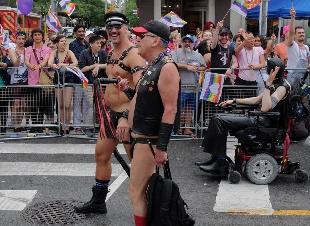 men in leather but no clothes walking in parade 