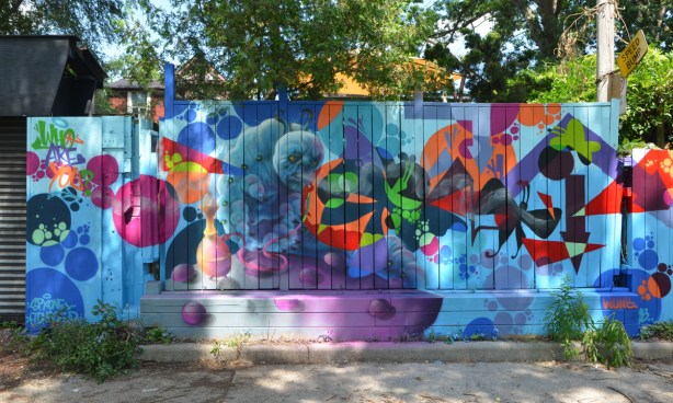 mural on a wood fence - butterflies and flowers