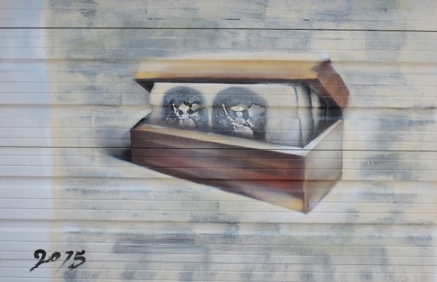 painting of a wooden box with papers in it, pictures of people on the papers