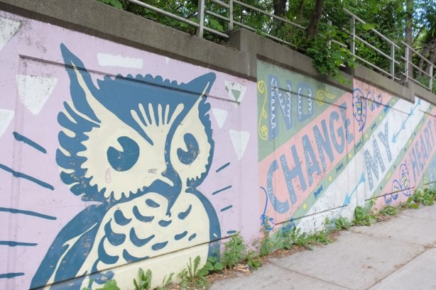 mural, large blue and white owl, with words in large letters that say no change my heart