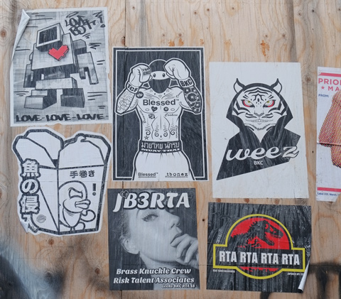 paste ups on plywood hoardings, 