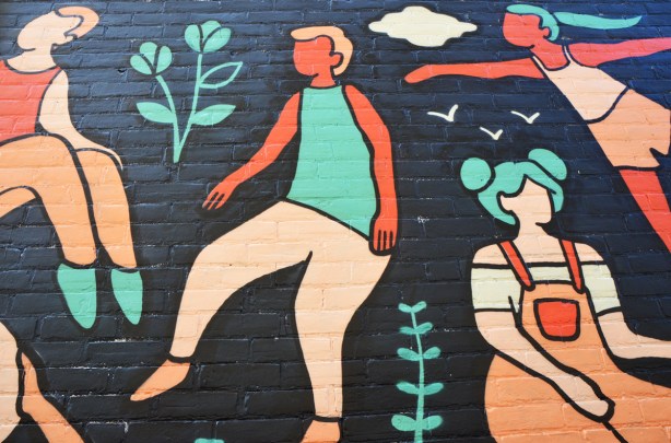 part of a mural by Emily May Rose of dancing female figures on a black background