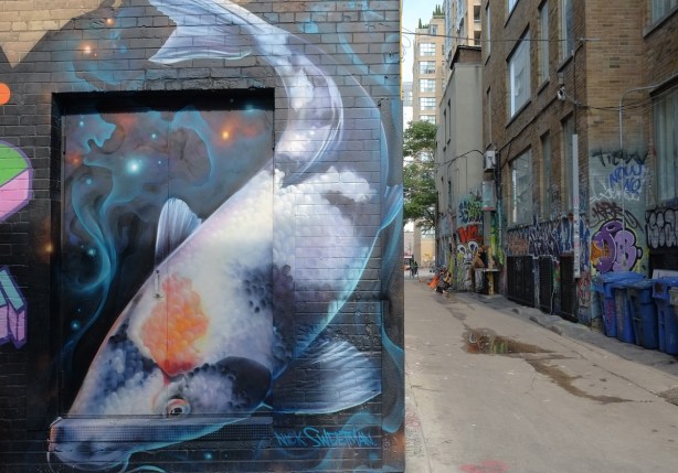 a large carp mural by Nick Sweetman in Graffiti Alley 
