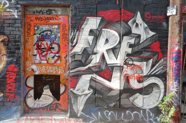 orange door and street art in Graffiti Alley 