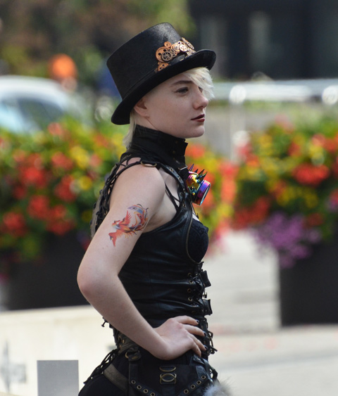 woman in black leather and tophat