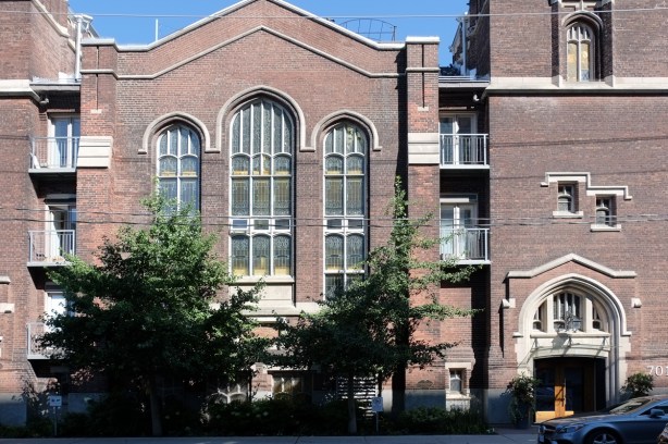 front of Centennial Methodist church on Dovercourt, now apartments, red brick building with large round top windows 