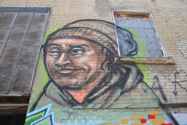 elicser painting of a man in a brown toque