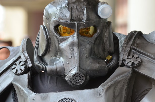 a person in an elaborate costume looking like a metal robot figure