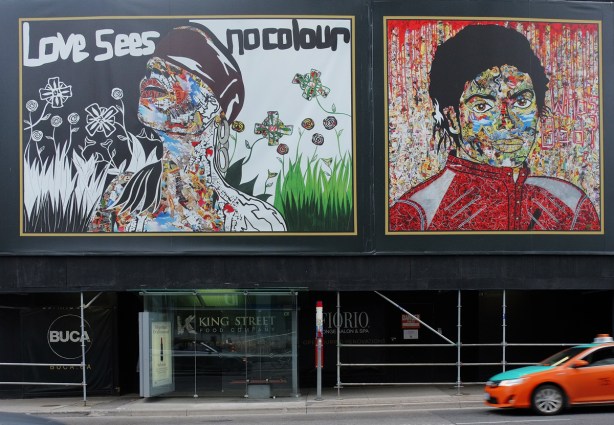 two murals by Daniel Mazzone, one of which is Michael Jackson in his red Thriller jacket, and the other is a woman in a cap blowing dandelions white puffy stuff, other flowers and butterflies too along with the words Love Sees No Colours.