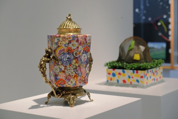 artwork by Leopold Foulem, a porcelain piece with gold figures on the sides like handles 