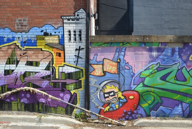 spaceman spliff in a popart mural by Matt Gondek and Jackson, in an alley