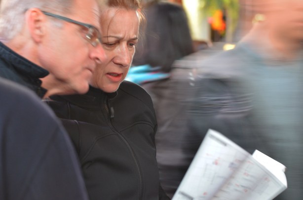 a couple looks at the Nuit Blanche map