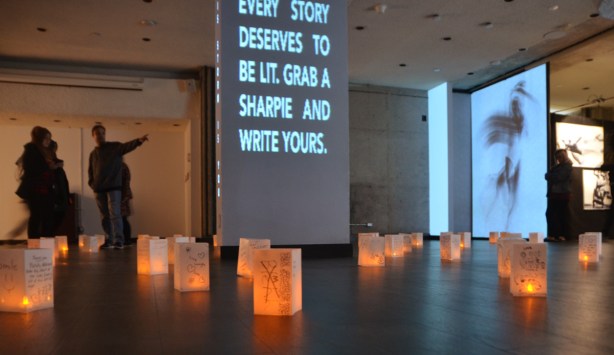 lit sign, large capital letters in pale blue, Every Story deserves to be lit. Grab a sharpie and write yours.