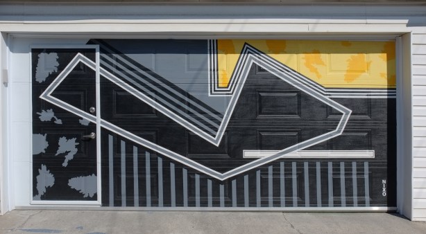 graphic looking design painted on a garage door in black and yellow with grey lines, by nixo