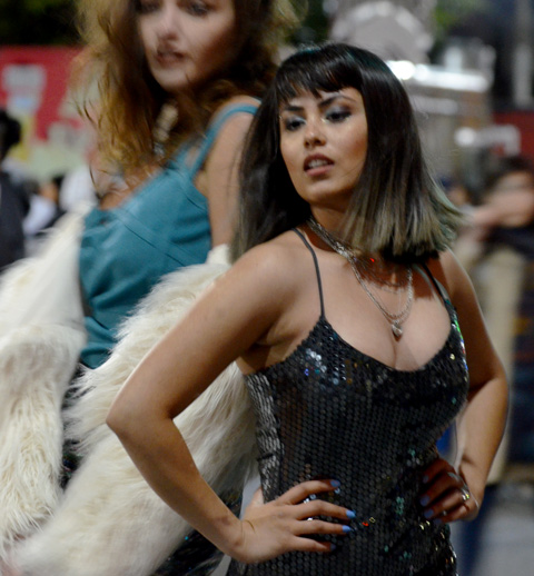 two young women posing on the street