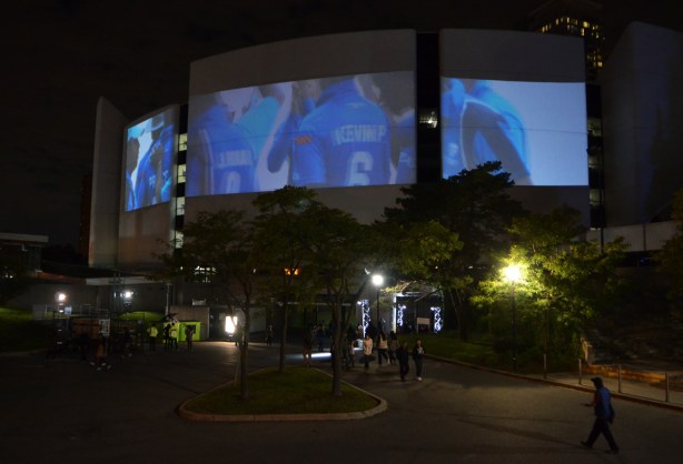 large projections on the concrete wall of Scarborough Civic Center