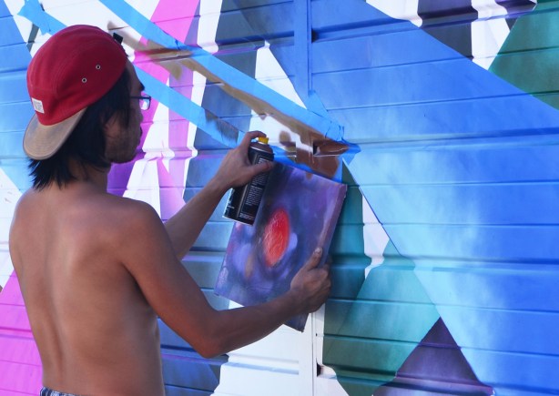 spray painting a mural