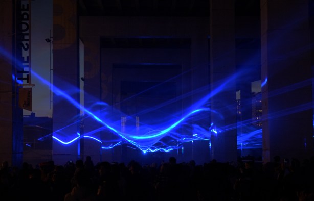 blue lights under the Gardiner at the Bentway, in front of Fort York, a light show called Waterlicht by Dutch artist Daan Roosegaarde