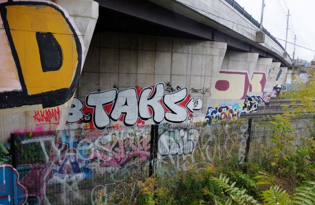 graffiti on the concrete bridge supports, Dundas St West over the railway tracks, taken from the West Toronto Railpath 