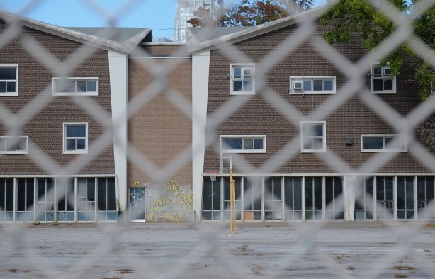 back of part of Davisville public school through chainlink fence, before demolition