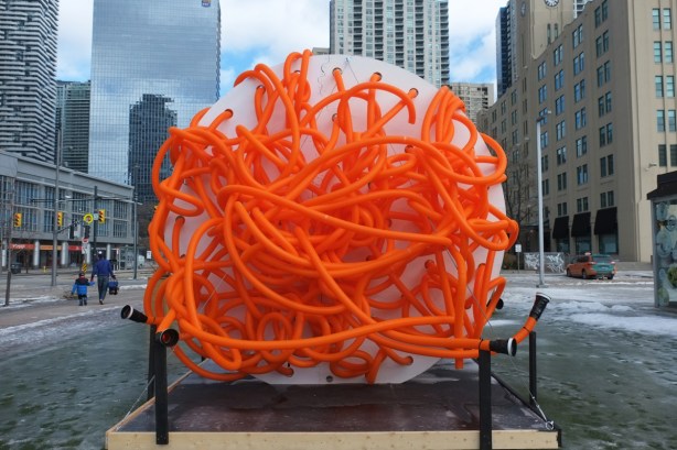 Connectors, a large art installation consisting of bright orange plastic tubes are jumbled up together