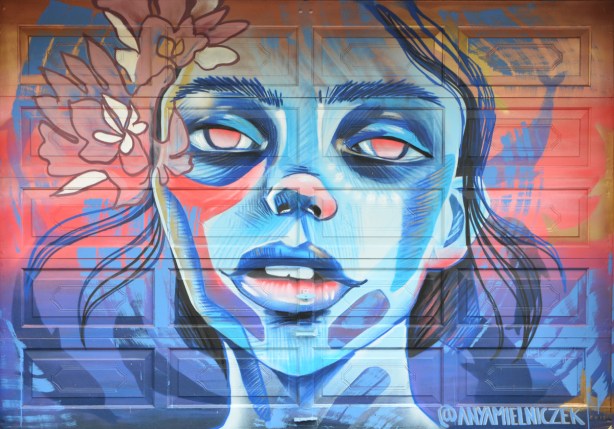 a mural of a woman's face by Anya Mielniczek