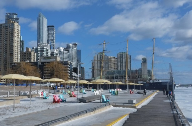view of H 2 O beach in toronto from the west, looking towards the Toronto skyline, winter, no leaves on the treees and some snow on the ground
