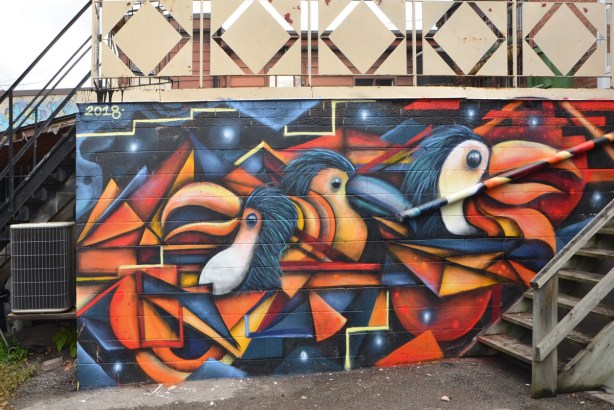 colourful abstract mural of three birds