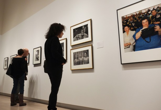 people looking at framed photographs being exhibited at Ryerson Image Centre 
