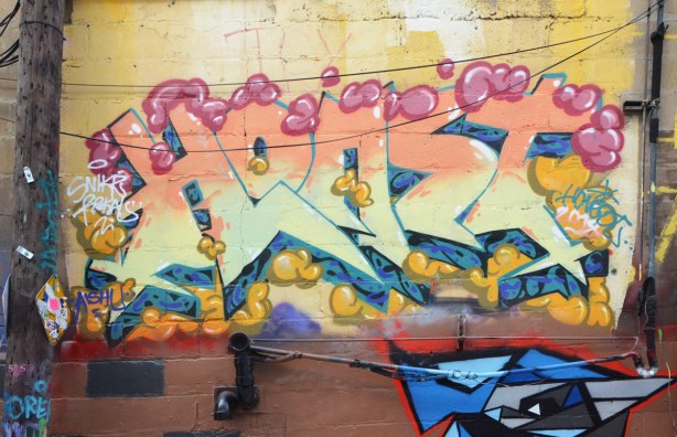 a text graffiti by horst, yellows and pale pinks 