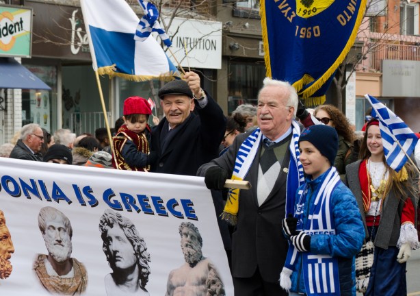 a group of people, older men with kids, Greek Independence day parade 