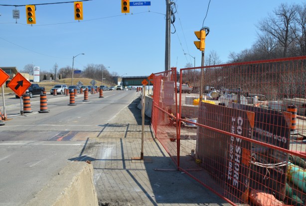 on the south side of Eglinton, where the sidewalk ends at Leslie street, looking east beyond that with construction on the right 