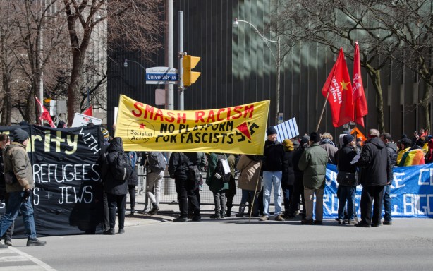 smash racists says a yellow banner