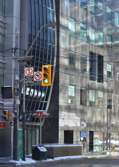 buildings on the southwest corner of University Ave and King Street, traffic lights, entrance to St. Andrew subway station