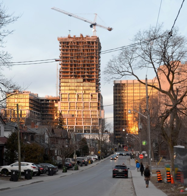condo development, crane, single houses in the foreground, near Yonge & Eglinton 
