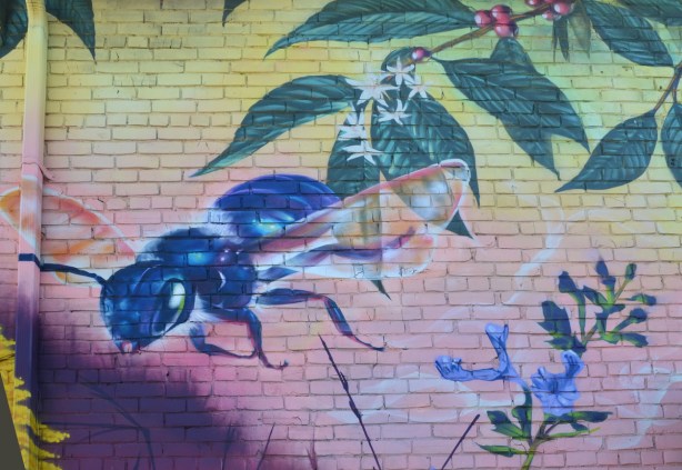 part of a nick sweetman pollinators mural, a blue bee