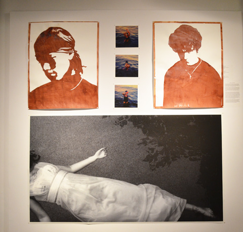 six images. On the bottom is one large black and white photo of a woman (no head shown) in a long white dress that looks like she's washed up on the beach, lying on her back, arms out streteched. upper level has 5 photos, on the sides are large brown and white images of men's head and shoulders, with eyes looking downward. In the middle of the top part are three snapshots of a person coming out of the lake after swimming 