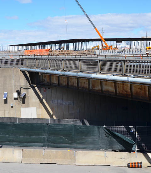 construction beside a bridge, underpass is a street