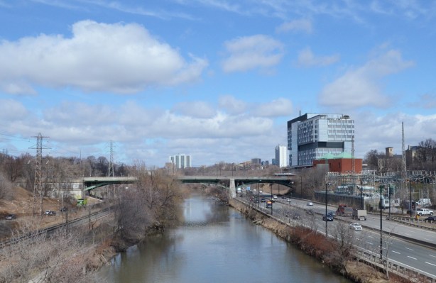 brige over the Don River, earl spring, no snow or ice but no leaves yet on the trees, Don Valley Parkway, road, to the right of the river, looking north towards Gerrard street 