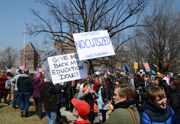 Crowds at a protest at Queens Park, 