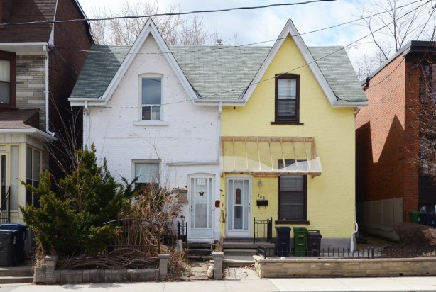 a semi-divided house, one side white and the other side yellow