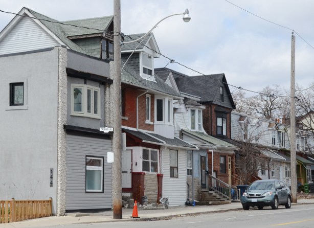 row houses in brown, white, and grey