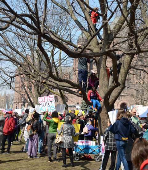 Crowds at a protest at Queens Park, 
