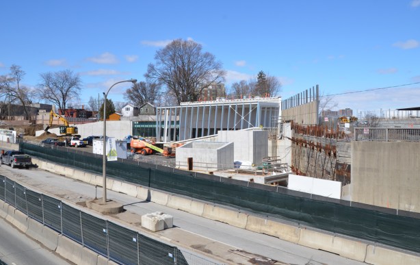 construction of Mt Dennis LRT station beside Eglinton ave and beside railway tracks 