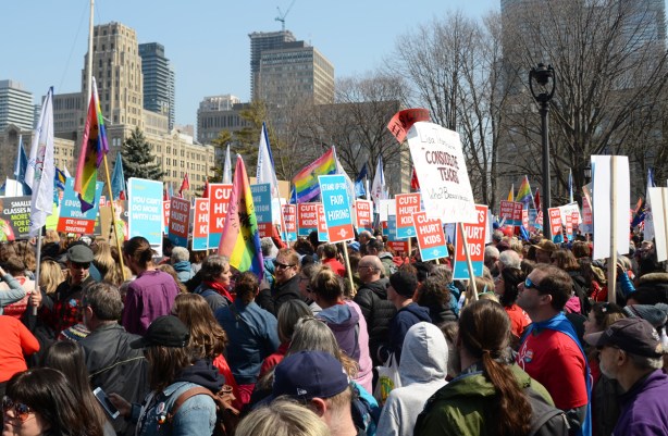 Crowds at a protest at Queens Park, 