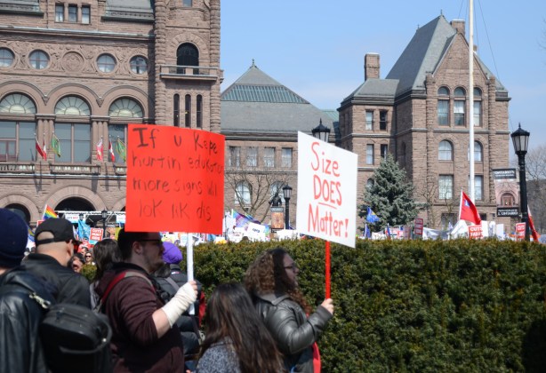 Crowds at a protest at Queens Park, 