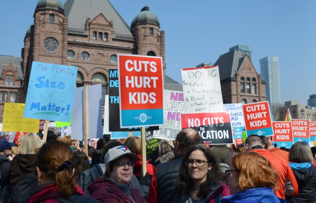 Crowds at a protest at Queens Park, 