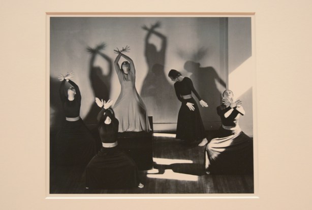 photograph from 1938 by Lotte Jacobi, of women dancing, light and shadows on the back wall 